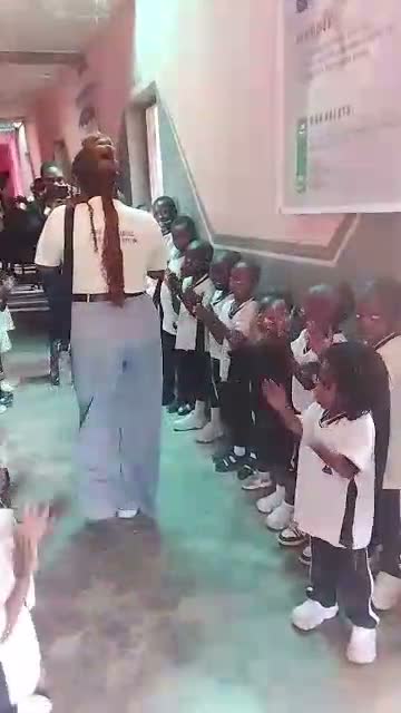Pupils clapping along during an interactive moment in the seminar