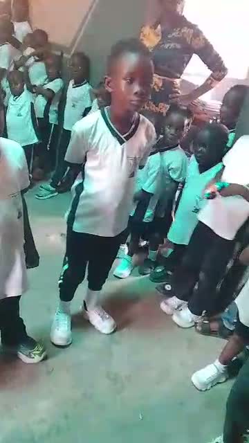A pupil standing with his classmates during the seminar session